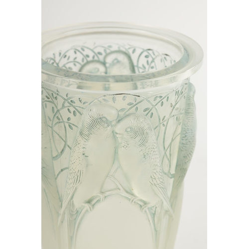 25 - AN R. LALIQUE OPALESCENT AND BLUE STAINED CEYLAN GLASS VASE with an arched tapering panelled body se... 