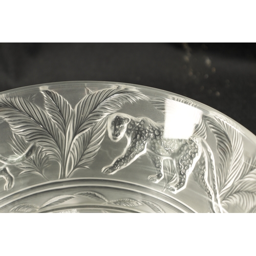 27 - A LALIQUE CLEAR AND FROSTED GLASS JUNGLE BOWL decorated with cheetahs and palm leaf decoration -engr... 