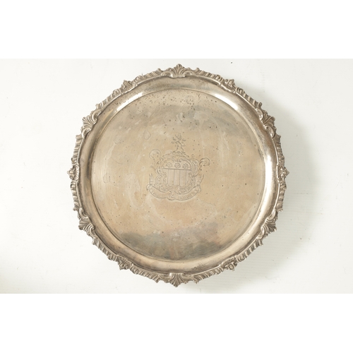 275 - A GEORGE III SILVER CIRCULAR SALVER of heavy gauge silver plain centre and embossed gadrooned rim wi... 