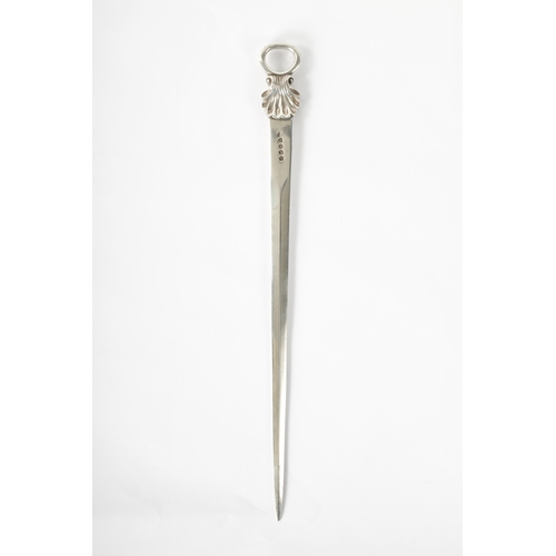 279 - A LATE GEORGIAN SILVER LETTER OPENER with shell moulded top London, dated 1811, 128cm high (32.5cm o... 