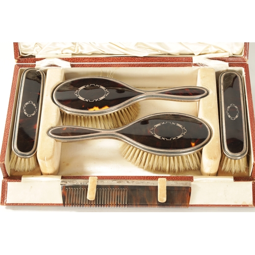 280 - AN EARLY 20TH CENTURY SILVER AND TORTOISESHELL SIX PIECE CASED DRESSING TABLE SET comprising of a mi... 