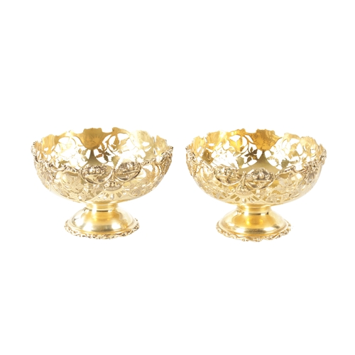 285 - A PAIR OF EARLY 20TH CENTURY SILVER GILT BON BON DISHES having pierced leaf work decoration, by Nath... 