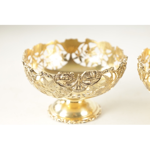 285 - A PAIR OF EARLY 20TH CENTURY SILVER GILT BON BON DISHES having pierced leaf work decoration, by Nath... 