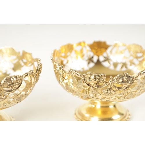 285 - A PAIR OF EARLY 20TH CENTURY SILVER GILT BON BON DISHES having pierced leaf work decoration, by Nath... 