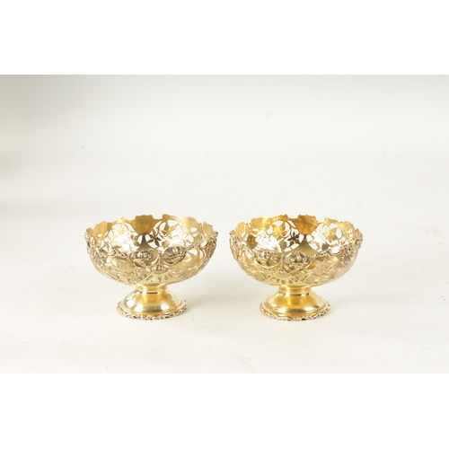 285 - A PAIR OF EARLY 20TH CENTURY SILVER GILT BON BON DISHES having pierced leaf work decoration, by Nath... 