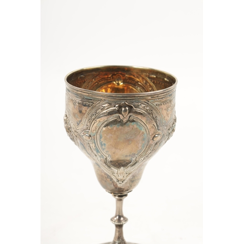 291 - A VICTORIAN SILVER AND SILVER GILT GOBLET embossed to the body with Queen Victoria's pets, Dash the ... 