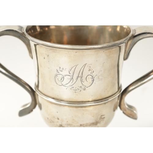 293 - A GEORGE III SILVER LOVING CUP the plain two-handled urn shaped body with engraved monogram, girdled... 