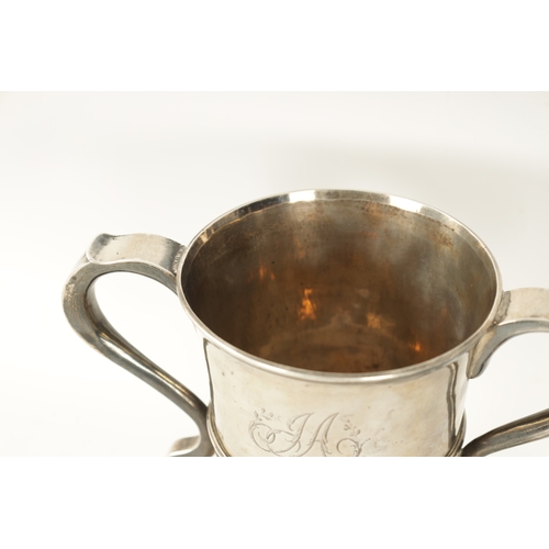 293 - A GEORGE III SILVER LOVING CUP the plain two-handled urn shaped body with engraved monogram, girdled... 