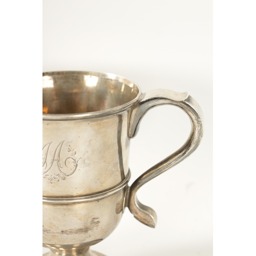 293 - A GEORGE III SILVER LOVING CUP the plain two-handled urn shaped body with engraved monogram, girdled... 