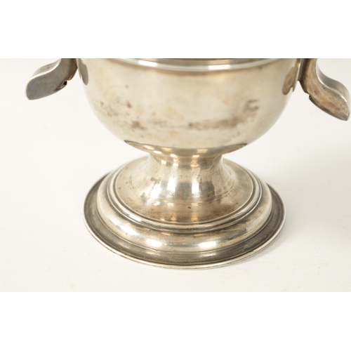 293 - A GEORGE III SILVER LOVING CUP the plain two-handled urn shaped body with engraved monogram, girdled... 