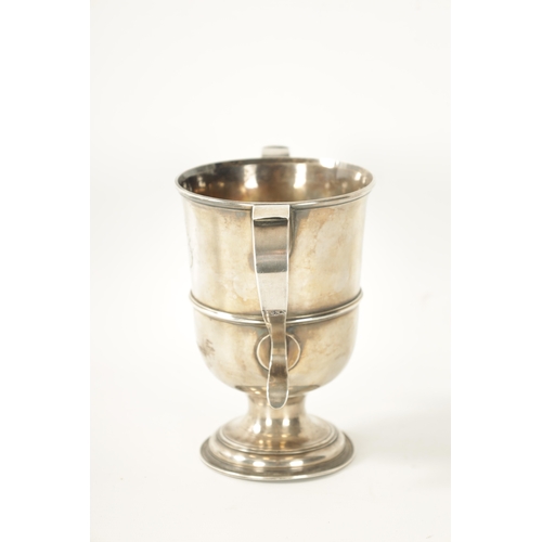 293 - A GEORGE III SILVER LOVING CUP the plain two-handled urn shaped body with engraved monogram, girdled... 