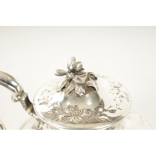 294 - A LATE REGENCY SILVER TEAPOT decorated with rococo style leafwork scrolls and rose finial with bone ... 