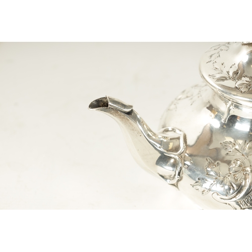 294 - A LATE REGENCY SILVER TEAPOT decorated with rococo style leafwork scrolls and rose finial with bone ... 