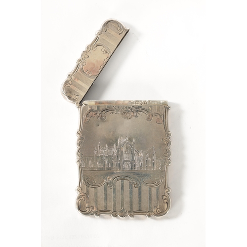 295 - A NATHANIAL MILLS VICTORIAN SILVER CARD CASE EMBOSSED WITH A CASTLE AND ABBEY of shaped rectangular ... 