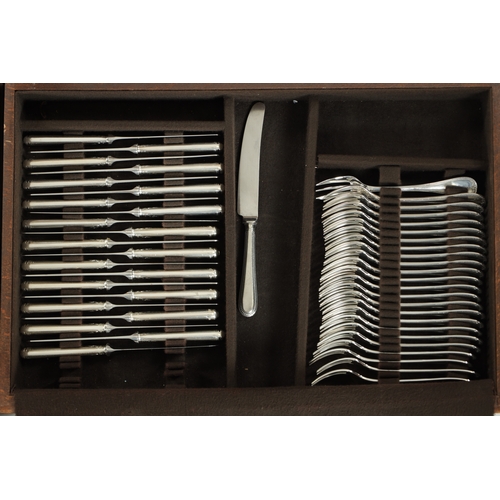 297 - A LARGE EARLY 20TH CENTURY 24SERVING FRENCH CHRISTOFLE SILVER PLATED CUTLERY SET in two fitted oak b... 