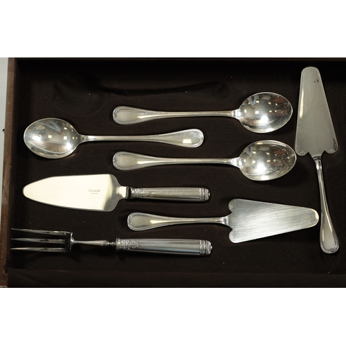 297 - A LARGE EARLY 20TH CENTURY 24SERVING FRENCH CHRISTOFLE SILVER PLATED CUTLERY SET in two fitted oak b... 