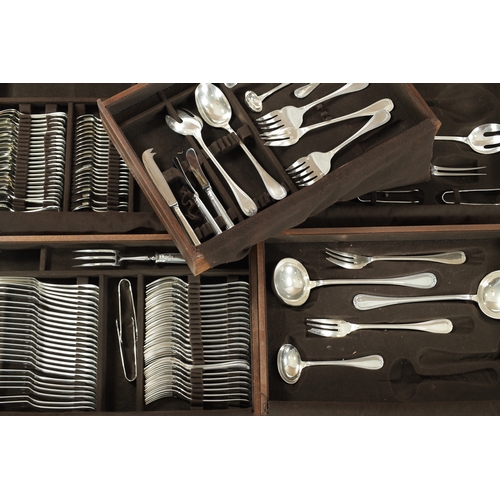 297 - A LARGE EARLY 20TH CENTURY 24SERVING FRENCH CHRISTOFLE SILVER PLATED CUTLERY SET in two fitted oak b... 