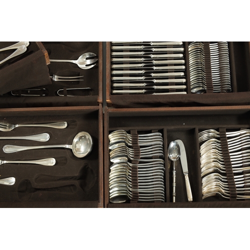 297 - A LARGE EARLY 20TH CENTURY 24SERVING FRENCH CHRISTOFLE SILVER PLATED CUTLERY SET in two fitted oak b... 