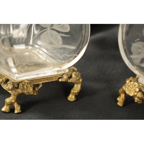 30 - A PAIR OF 19TH CENTURY FRENCH ROCK CRYSTAL ORMOLU MOUNTED VASES with etched leaf work and floral des... 