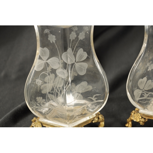 30 - A PAIR OF 19TH CENTURY FRENCH ROCK CRYSTAL ORMOLU MOUNTED VASES with etched leaf work and floral des... 