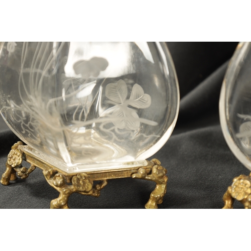 30 - A PAIR OF 19TH CENTURY FRENCH ROCK CRYSTAL ORMOLU MOUNTED VASES with etched leaf work and floral des... 