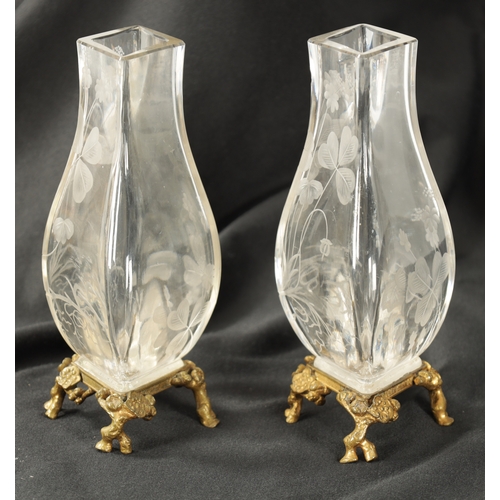 30 - A PAIR OF 19TH CENTURY FRENCH ROCK CRYSTAL ORMOLU MOUNTED VASES with etched leaf work and floral des... 