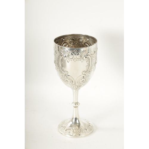 300 - A LATE 19TH CENTURY SILVER GOBLET having embossed decoration with inscription dated 1897 by James De... 