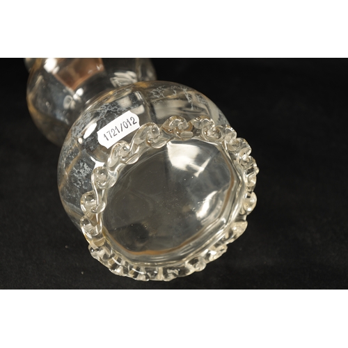 301 - A LATE 19TH CENTURY SILVER MOUNTED GLASS DECANTER of shaped form with crimped edge and silver neck w... 