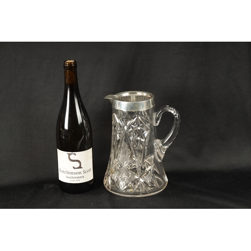 309 - AN EARLY 20TH CENTURY CUT GLASS AND SILVER MOUNTED LEMONADE JUG of tapering form with twist of peirc... 