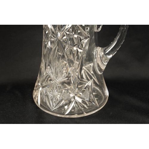 309 - AN EARLY 20TH CENTURY CUT GLASS AND SILVER MOUNTED LEMONADE JUG of tapering form with twist of peirc... 