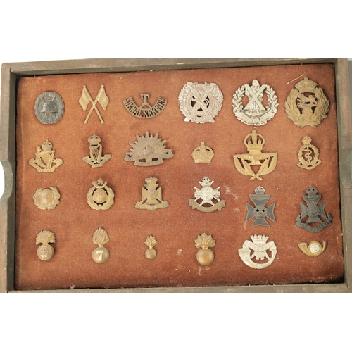 316 - A LARGE COLLECTION OF MILITARY MEDALS AND HAT BADGES displayed on three velvet lined trays