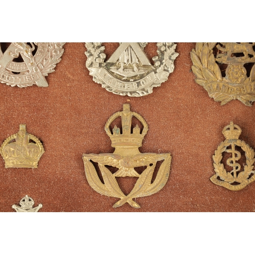 316 - A LARGE COLLECTION OF MILITARY MEDALS AND HAT BADGES displayed on three velvet lined trays