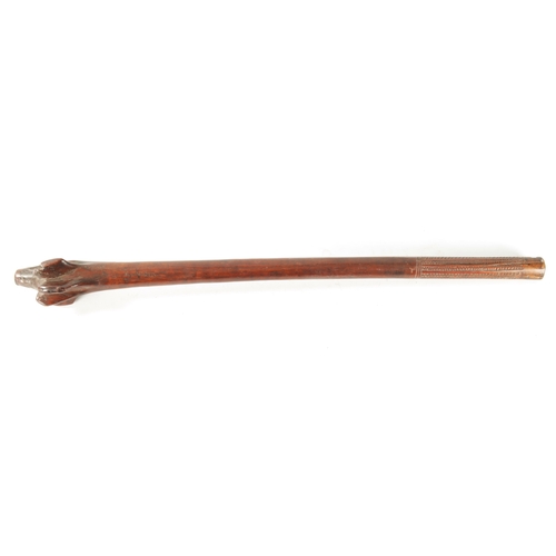 317 - A GOOD 19TH CENTURY FIJIAN ROOT WOOD FIGHTING CLUB with swiggle work carved handle. (107cm overall)