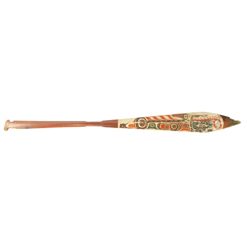 318 - A 19TH CENTURY AMERICAN TRIBAL STAINED SOFTWOOD DANCE PADDLE with painted double-sided blade. (151cm... 