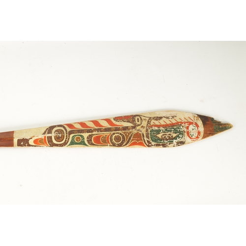 318 - A 19TH CENTURY AMERICAN TRIBAL STAINED SOFTWOOD DANCE PADDLE with painted double-sided blade. (151cm... 