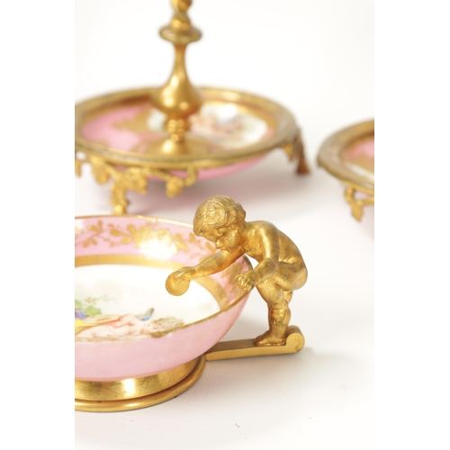 32 - A 19TH CENTURY FRENCH SERVES STYLE PORCELAIN AND ORMOLU MOUNTED DESK SET comprising of a letter rack... 