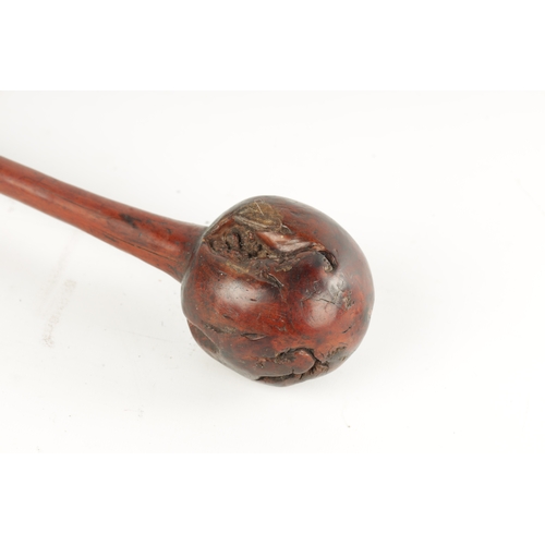 329 - A 19TH CENTURY ROOT HARDWOOD KNOBKERRIE with carved wriggle work handle. (40cm overall )