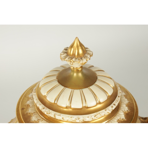 33 - JOHN STINTON. A FINE RICHLY GILT, RELIEF MOULDED TWO HANDLED BULBOUS BLUSHED IVORY POT POURRI CABINE... 