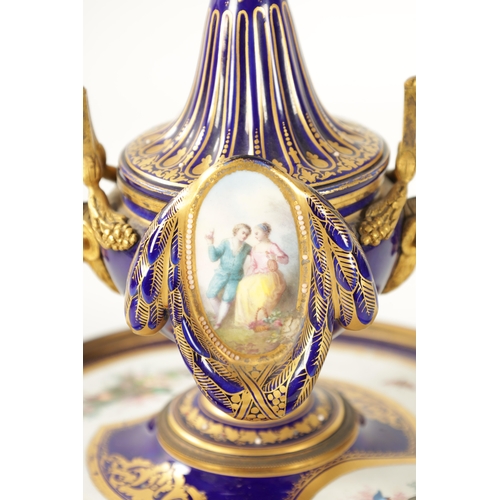 39 - A LATE 19TH CENTURY FRENCH SEVRES TYPE ORMOLU MOUNTED AND JEWELLED PORCELAIN INKWELL the central ves... 