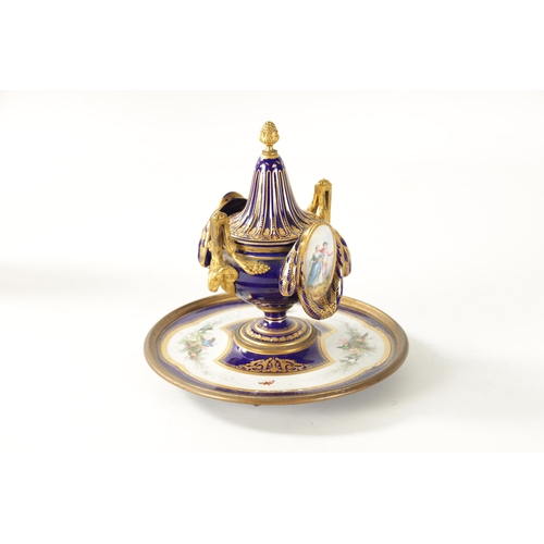 39 - A LATE 19TH CENTURY FRENCH SEVRES TYPE ORMOLU MOUNTED AND JEWELLED PORCELAIN INKWELL the central ves... 