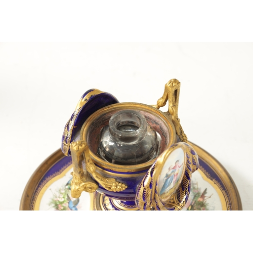 39 - A LATE 19TH CENTURY FRENCH SEVRES TYPE ORMOLU MOUNTED AND JEWELLED PORCELAIN INKWELL the central ves... 