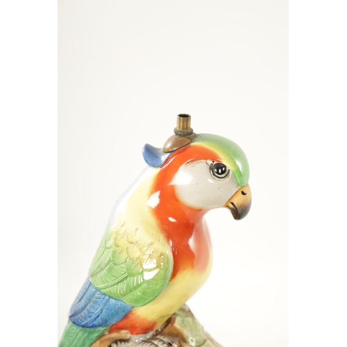 43 - AN EARLY 20TH CENTURY ROYAL DOULTON PORCELAIN AND CAST BRASS TABLE LAMP FORMED AS A PARROT the colou... 