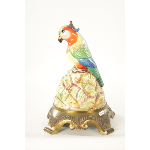 43 - AN EARLY 20TH CENTURY ROYAL DOULTON PORCELAIN AND CAST BRASS TABLE LAMP FORMED AS A PARROT the colou... 