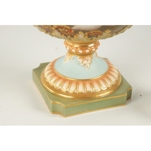 47 - C.H.C. BALDWYN A FINE ROYAL WORCESTER PEDESTAL CABINET VASE AND COVER the richly gilt and pink tinte... 