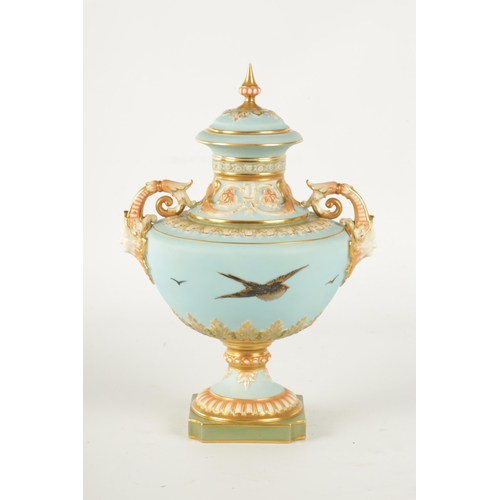 47 - C.H.C. BALDWYN A FINE ROYAL WORCESTER PEDESTAL CABINET VASE AND COVER the richly gilt and pink tinte... 