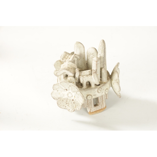 49 - IAN GODFREY (BRITISH, 1942-1992) A STONEWARE SCULPTURE Modelled as a landscape in ring form with cre... 