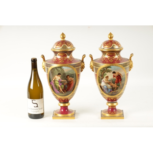 61 - A FINE PAIR OF VIENNA PORCELAIN URN SHAPED LIDDED VASES with floral gilt decoration surrounding oval... 