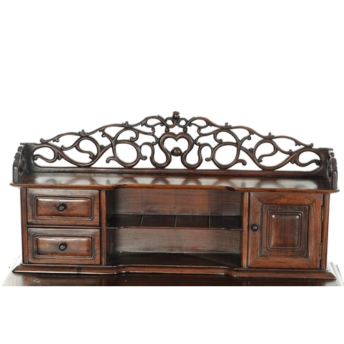 65 - 18TH CENTURY CHINESE HARDWOOD WRITING TABLE with pierced leafwork superstructure above a panelled to... 