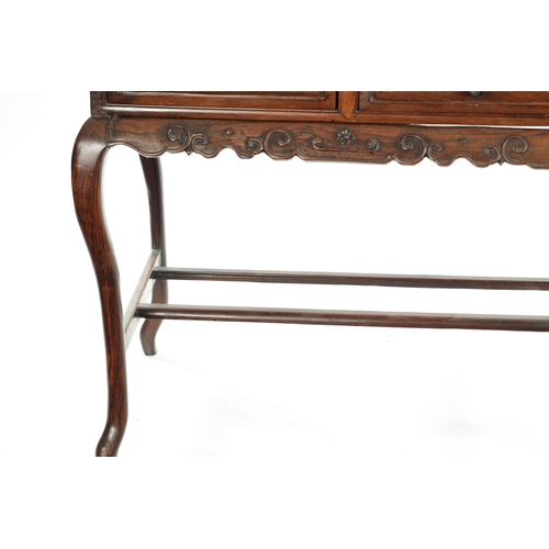 65 - 18TH CENTURY CHINESE HARDWOOD WRITING TABLE with pierced leafwork superstructure above a panelled to... 