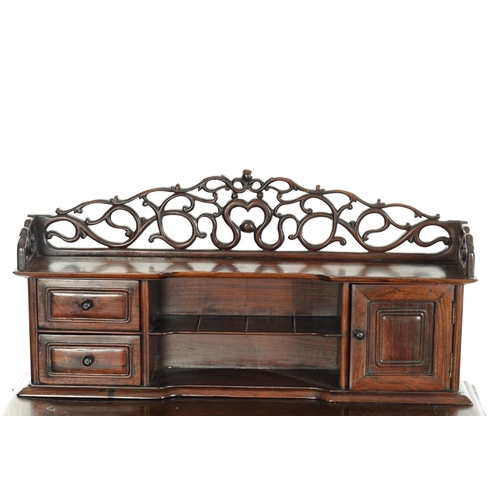 65 - 18TH CENTURY CHINESE HARDWOOD WRITING TABLE with pierced leafwork superstructure above a panelled to... 